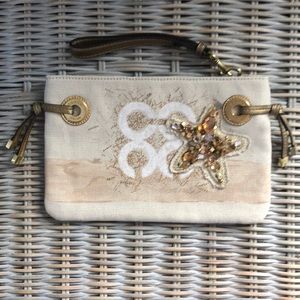 Coach wristlet with beaded starfish. Wave print